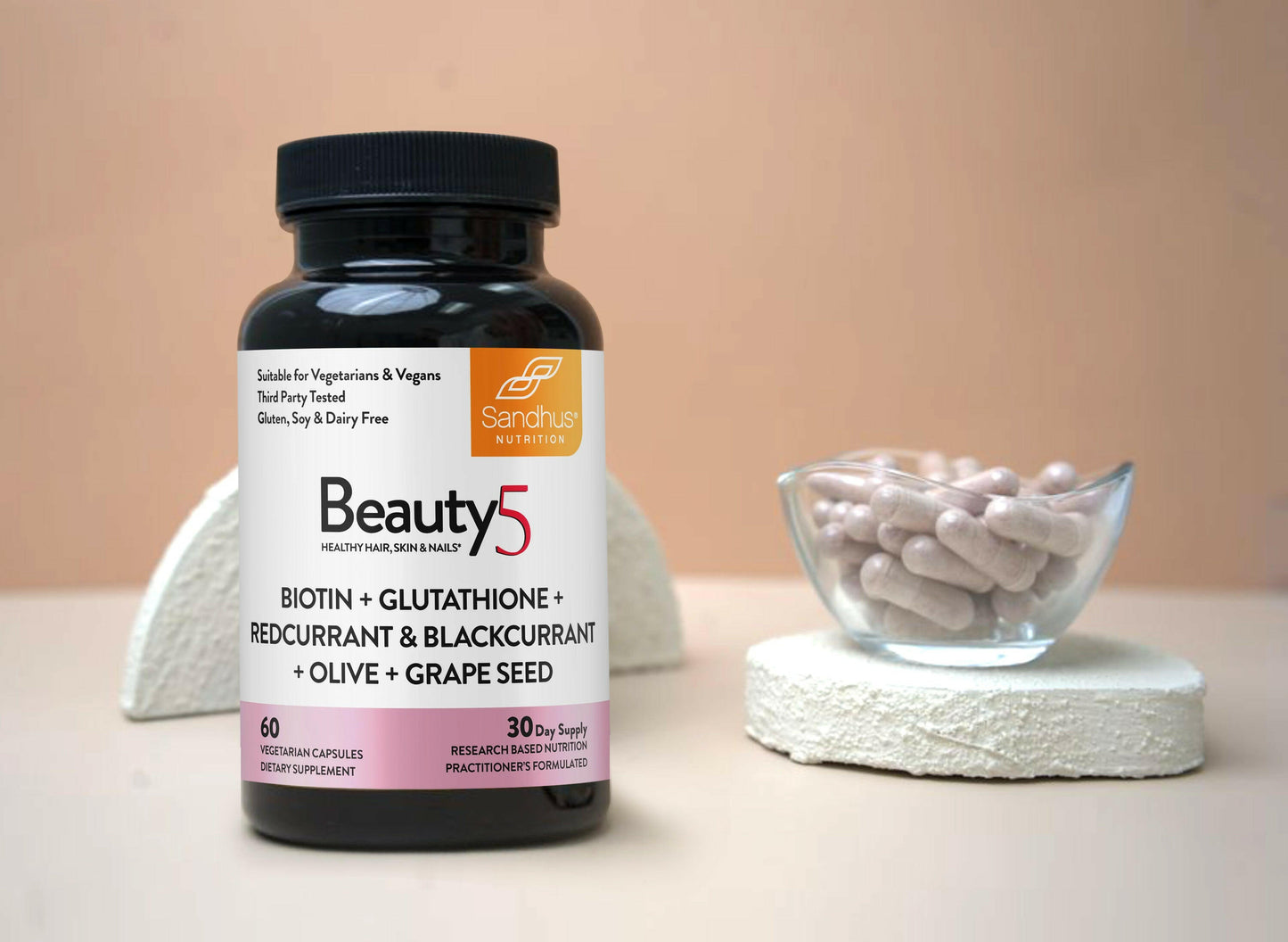 Supplement bottle labeled 'Beauty5' with capsules on a neutral background