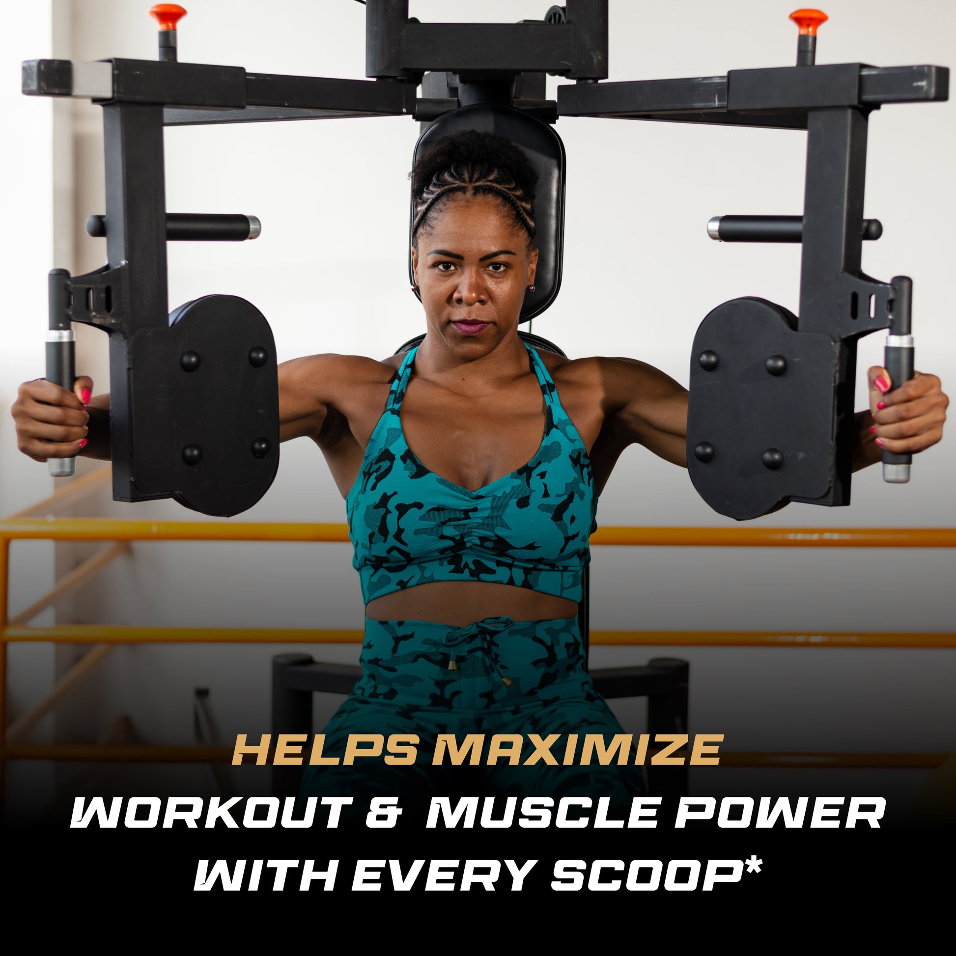 Woman trains on a chest press machine showing focused form and control strength