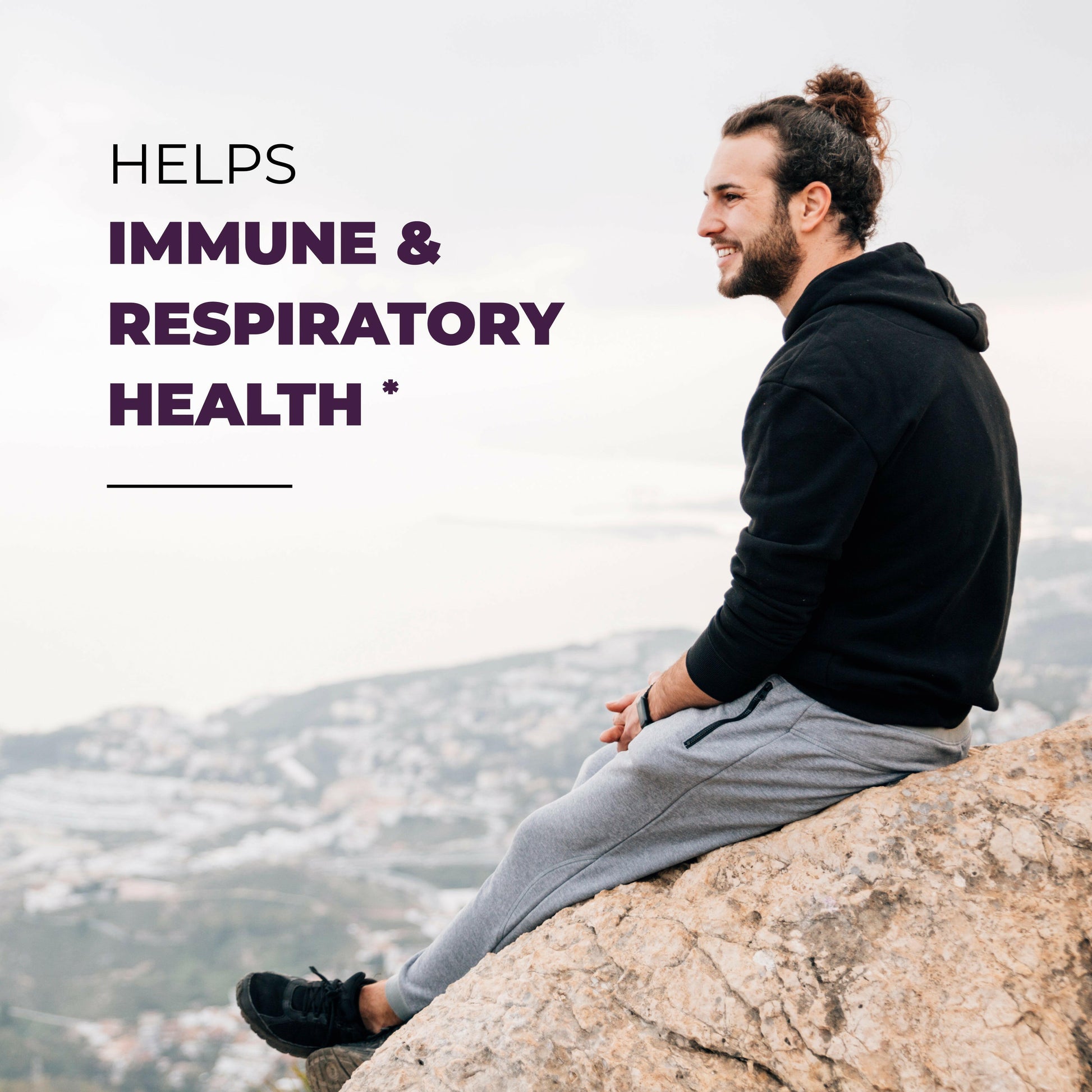 Man sitting on a rock with mountains in the background, text about immune and respiratory health.