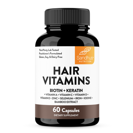 A bottle of Sandhu's Hair Vitamins supplement with 60 capsules, featuring biotin and keratin as key ingredients.