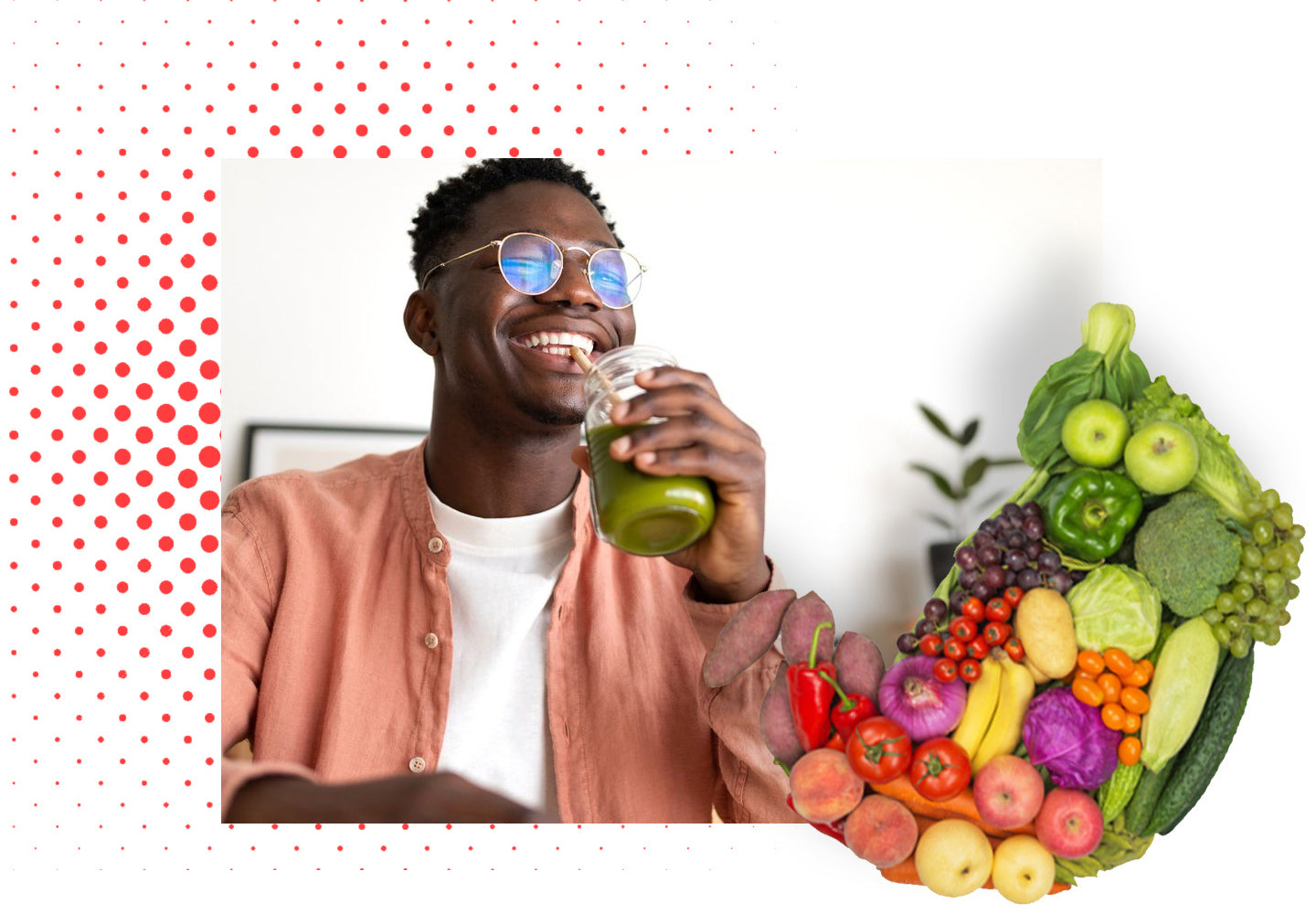 A person smiling while drinking a green smoothie, with assorted fresh fruits and vegetables in the foreground