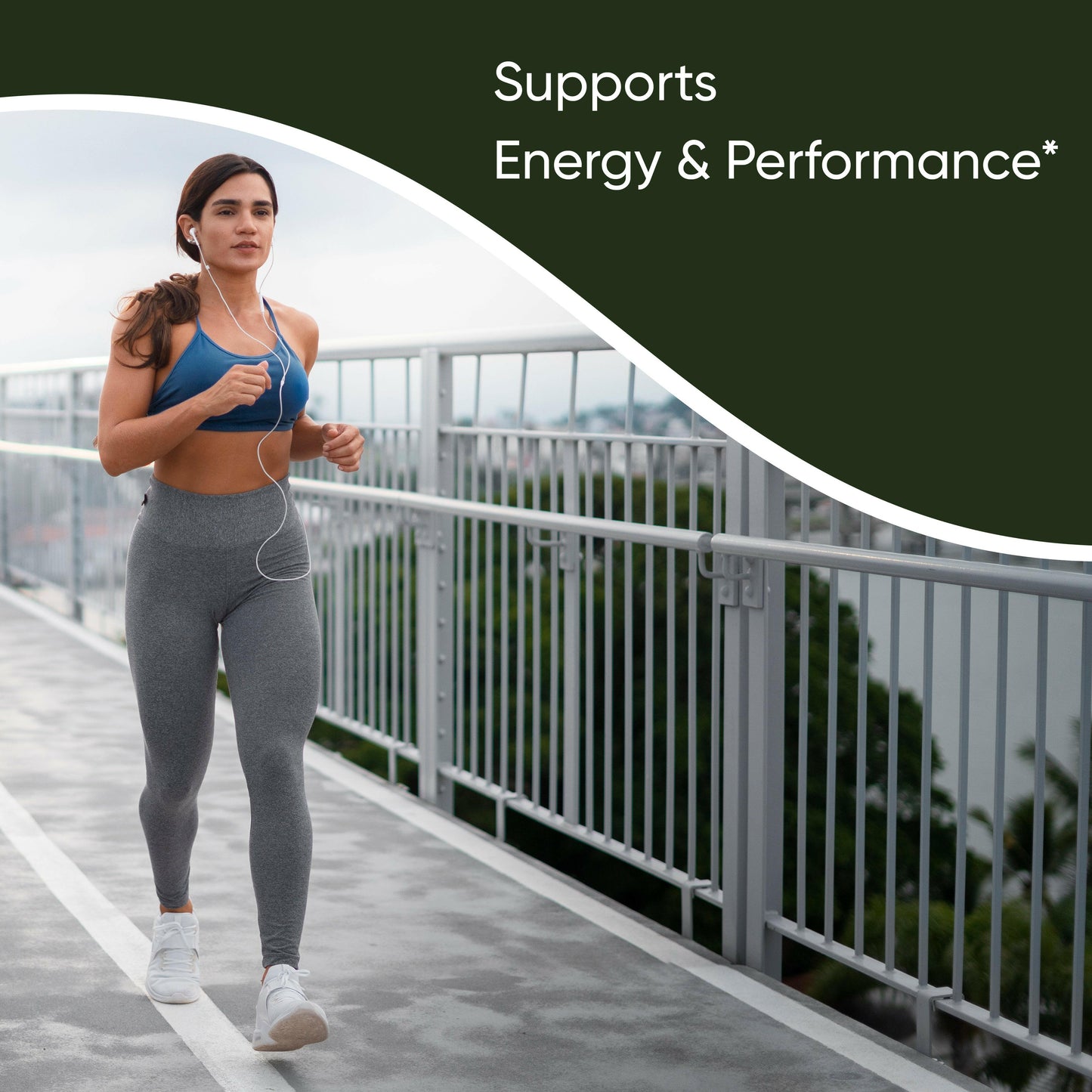Woman jogging outdoors with earphones, representing energy and performance support with Sandhus Liver supplement.