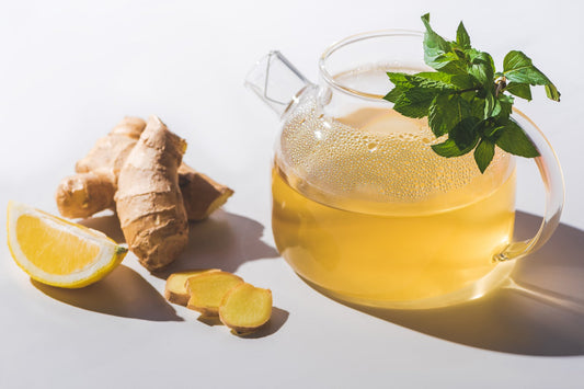Warm ginger lemon herbal tea with fresh mint, known for supporting clear breathing and soothing respiratory comfort during winter