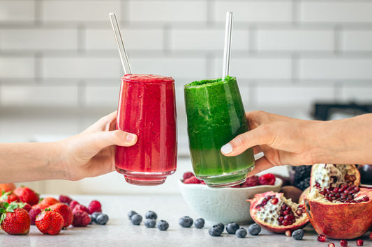 Two fresh smoothies made with berries and greens, nutrient-rich morning drinks that may help stabilize glucose levels naturally.