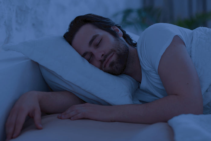 Man sleeping peacefully at night maintaining a balanced sleep cycle