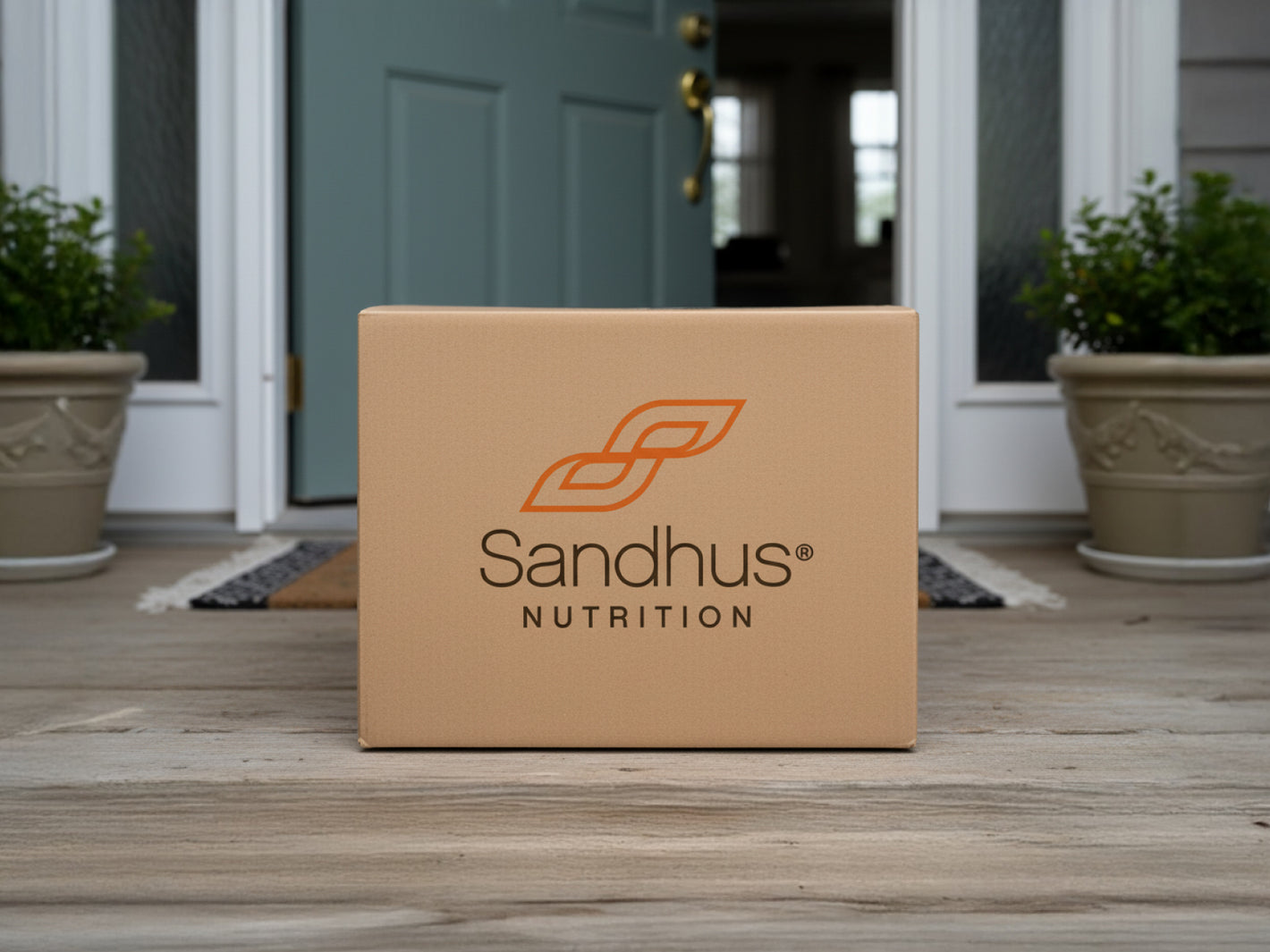 Sandhus Nutrition delivery box placed at doorstep symbolizing fast shipping and subscription home delivery benefits.