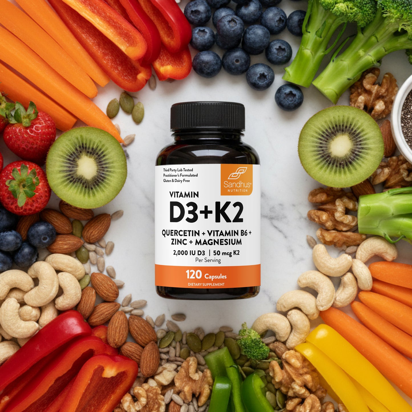 Vitamin D3+K2 supplement bottle surrounded by fruits, vegetables, and nuts on a white background