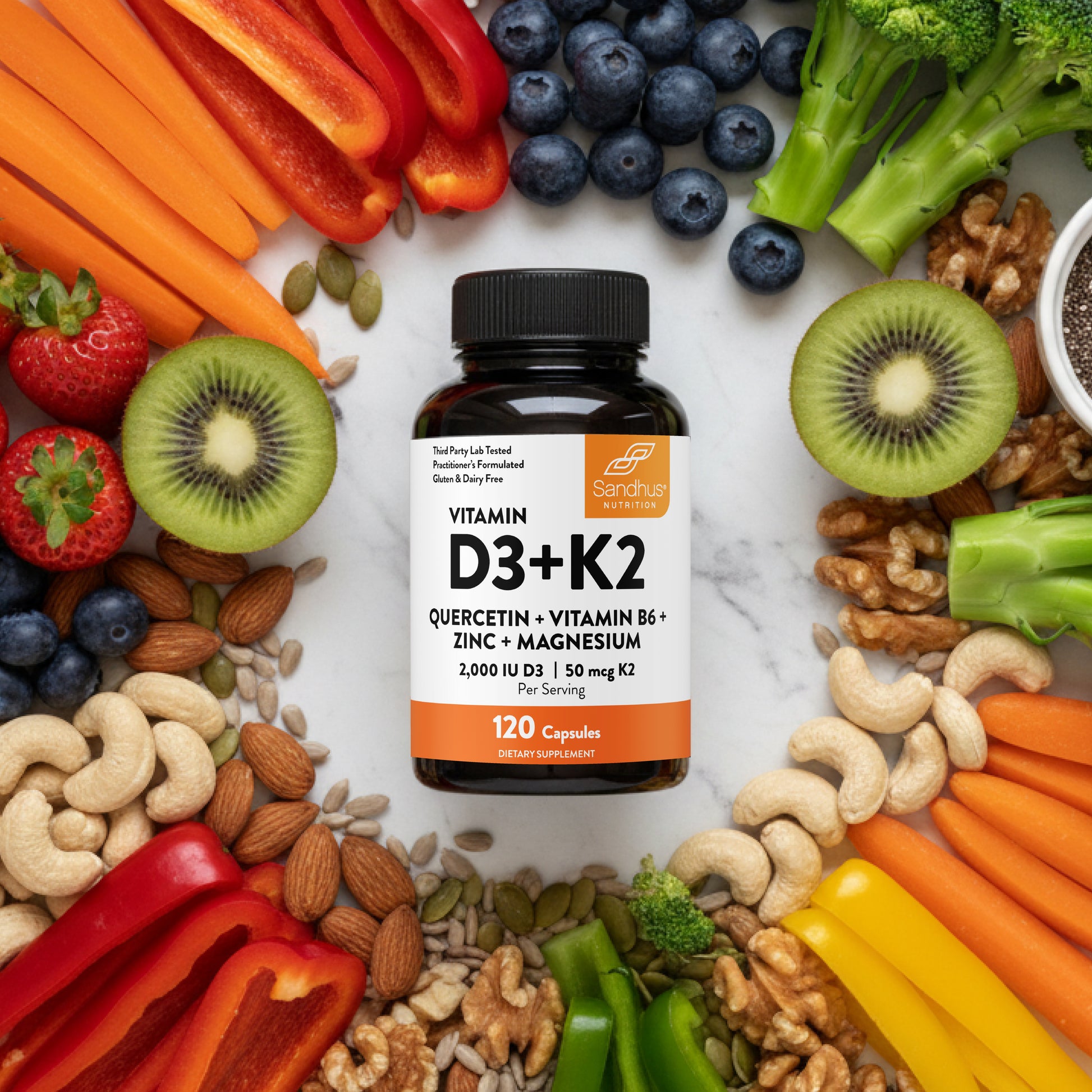 Vitamin D3+K2 supplement bottle surrounded by fruits, vegetables, and nuts on a white background